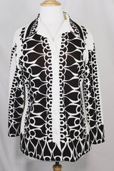 Women's vintage 1970's Brookvalley by Fairfield label long sleeve button up blouse in white with an all over abstract brown colored print.