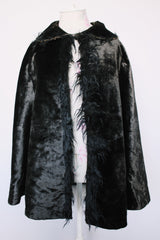 Women's vintage possibly 1940's black colored pony fur large cape poncho with fur trim around the edges. Has a closure at the neck and the peter pan collar and fully lined.