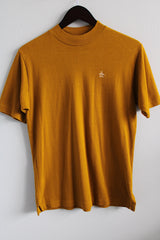 Women's or men's vintage 1980's Grand Slam by Munsingwear label short sleeve greenish brown tee with a small mock neck and penguin embroidery in a cotton and polyester material.