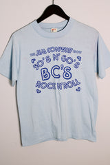 Men's or women's vintage 1970's Hef-T, Tee Jays, Made in USA label baby blue tee with Jim Conway show bright blue graphic on the front in cotton and polyester material.