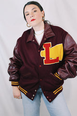 Men's or women's vintage 1980's Settlemien's label long sleeve maroon varsity letterman jacket with a yellow patch and trim.