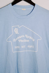 Women's or men's vintage 1970's Screen Stars, Made in USA label short sleeve light blue tee with a white graphic on the front in a polyester and cotton material.