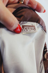 Men's vintage 1970's Montgomery Ward label long sleeve light brown colored button up shirt with all over floral print.