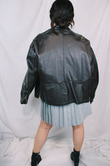 Men's or women's vintage 1980's Kirk's Suede Life label long sleeve oversized dark chocolate brown leather bomber jacket with zipper front closure.