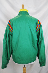 Women's or men's vintage 1980's Pacific Trail Sportswear label long sleeve green zip up nylon puffer jacket with yellow and rainbow colored trim.