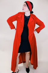 Women's vintage 1950's/60's Count Romi LTD., Your All Weather Traveler label long sleeve long length bright red velvet duster coat. One closure at waist.