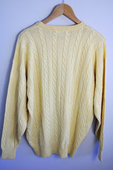 Men's or women's vintage 1960's Pringle label long sleeve pullover sweater in lambswool material. Butter yellow color and all over cable knit texture.