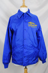 Women's or men's vintage 1980's Swingster, World of Wearables label long sleeve lightweight bright blue nylon windbreaker jacket with logo on left chest, popper buttons, and furry fleece liner.