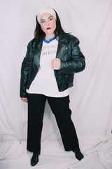 Men's or women's vintage 1970's Genuine Leather, Made in Mexico label long sleeve black leather moto leather jacket with silver hardware.