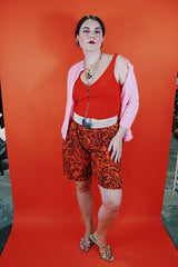 Women's vintage 1960's Catalina, California, USA label sleeveless one piece bright orange swimsuit with brass half zipper closure in the front.