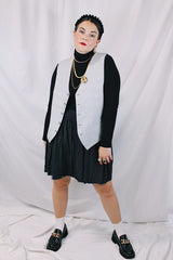 Men's or women's vintage 1960's Issued by Authority of Amalgamated Clothing, Union Made, Workers of America label sleeveless button up waistcoat with grey buttons and two front pockets. Reversible with one solid side and one plaid side