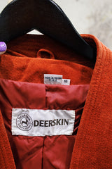 Women's vintage 1970's Deerskin Quality Leathers long sleeve open front lightweight suede leather jacket in a vibrant burnt orange color.