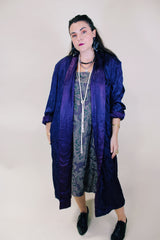 Women's vintage 1960's long sleeve purple satin robe. Long length and shiny material. Chest pocket and two side pockets.