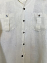 Men's or women's vintage 1970's Montgomery Ward label long sleeve cream colored cotton material button up shirt. Brown buttons and two chest pockets.