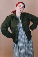 Men's vintage 1950's Caleb V. Smith & S, New York label size large dark green wool cropped fit long sleeve button up jacket with brown shearling liner.