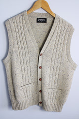 Men's or women's vintage 1970's Jantzen, Made in USA label sleeveless button up sweater vest cardigan in a wool and acrylic material. Oatmeal color with navy speckles and a cable knit texture.