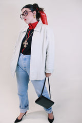 Women's vintage 1990's Worthington label long sleeve bone white leather jacket with a collar, a zipper up the front, and two side pockets.