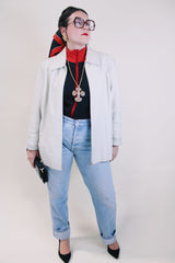 Women's vintage 1990's Worthington label long sleeve bone white leather jacket with a collar, a zipper up the front, and two side pockets.