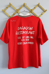 Women's vintage 1970's Hilton, Made in USA label short sleeve red half button closure polo bowling shirt with white striped collar and trim.