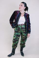 Women's vintage 1980's Saxton Hall, Made in Japan label long sleeve black velvet jacket with all over multicolored print and gold buttons.