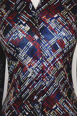 Women's vintage 1970's long sleeve button up blouse with a dagger collar in a navy blue color and all over abstract print.