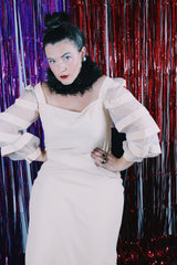 Women's vintage 1980's Made in USA label long sleeve mini length light tan colored dress.