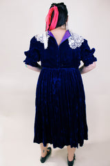 Women's vintage 1970's crushed blue velvet dress with cream embroidery peter pan collar. Short sleeves and ankle length.