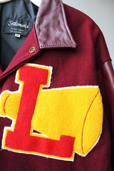 Men's or women's vintage 1980's Settlemien's label long sleeve maroon varsity letterman jacket with a yellow patch and trim.