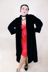 Women's vintage 1960's ankle length long sleeve black velvet duster jacket. Fully lined and has two side pockets.