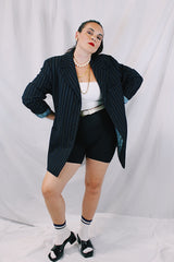 Men's or women's vintage 1970's University Seal Authentic Fashion label long sleeve navy blue wool blazer with all over pin stripes. Has pockets, textured buttons, and a back slit.