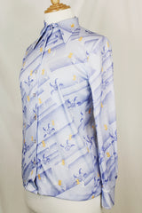 Women's vintage 1970's Devon long sleeve button up blouse with a dagger collar. Light purple color with all over ditsy floral print.