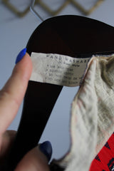 Women's vintage 1970's long sleeve red and navy colored striped zig zag top with half button front closure in a slinky polyester material.