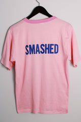 Women's vintage 1970's Chippie, Made in Bahamas label short sleeve bubblegum pink tee with a yellow and blue bee graphic on the front with a contrast trim.