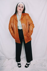 Men's or women's vintage 1970's Grodins label long sleeve tan light brown buttery leather jacket with button closure. Western style.