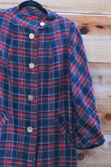 Women's vintage 1960's long label long length plaid tartan print jacket in black and red with gold buttons. Fully lined and has side pockets.