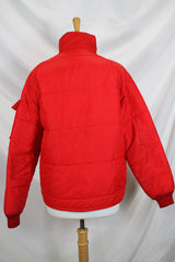 Women's or men's vintage 1980's Horizon Sportswear Inc., Made in USA label long sleeve red nylon puffer jacket with patch on left chest.