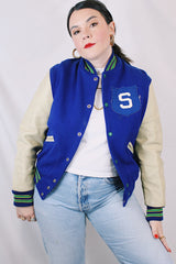 Men's or women's vintage 1970's Dehen, Award Letters, Beaverton, Oregon label long sleeve cream and vibrant blue varsity letterman jacket with green and yellow trim in wool and leather material.