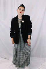 Women's vintage 1970's The Chaus Woman label long sleeve black velvet blazer in a cotton and rayon blend material. One button closure, two pockets, and fully lined.