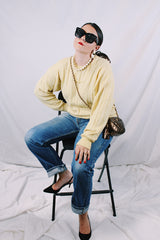 Men's or women's vintage 1960's Pringle label long sleeve pullover sweater in lambswool material. Butter yellow color and all over cable knit texture.