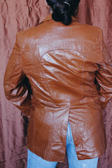 Women's or men's vintage 1970's Cresco label camel brown colored leather blazer jacket with two button closure and two front pockets.