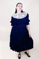 Women's vintage 1970's crushed blue velvet dress with cream embroidery peter pan collar. Short sleeves and ankle length.