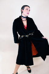 Women's vintage 1960's ankle length long sleeve black velvet duster jacket. Fully lined and has two side pockets.