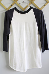 Women's or men's vintage 1970's Russell Athletic long sleeve black and white baseball tee with text on the back.