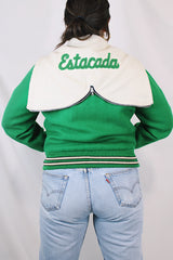 Women's vintage 1989 Nelson's Jacket, Portland, Oregon label bright green wool varsity letterman jacket with white trim. Has snap buttons, patches, pockets, and a hood. Shop more vintage outerwear and sportswear at Live Forever Vintage.