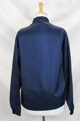 Men's or women's vintage 1980's Horizon Sportswear Inc., Made in USA label long sleeve navy blue nylon zip up windbreaker jacket with red and white vertical stripe down the front and patches.