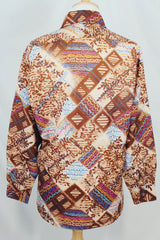 Men's vintage 1970's EPI, European Prime International label long sleeve lightweight polyester button up shirt in brown with all over multicolored abstract print.