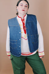 Men's vintage 1970's Roebucks, Sears label size XL sleeveless dark denim vest with cream shearling liner and popper buttons.