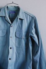 Men's or women's vintage 1970's Woodward's 7 Star Workwear label button up light blue chambray cotton shirt with two chest pockets.