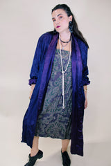 Women's vintage 1960's long sleeve purple satin robe. Long length and shiny material. Chest pocket and two side pockets.