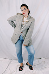 Men's or women's vintage 1960's Nordstrom, Harris Tweed, Tailored in the USA label long sleeve grey colored wool blazer with front pockets and partial lining.